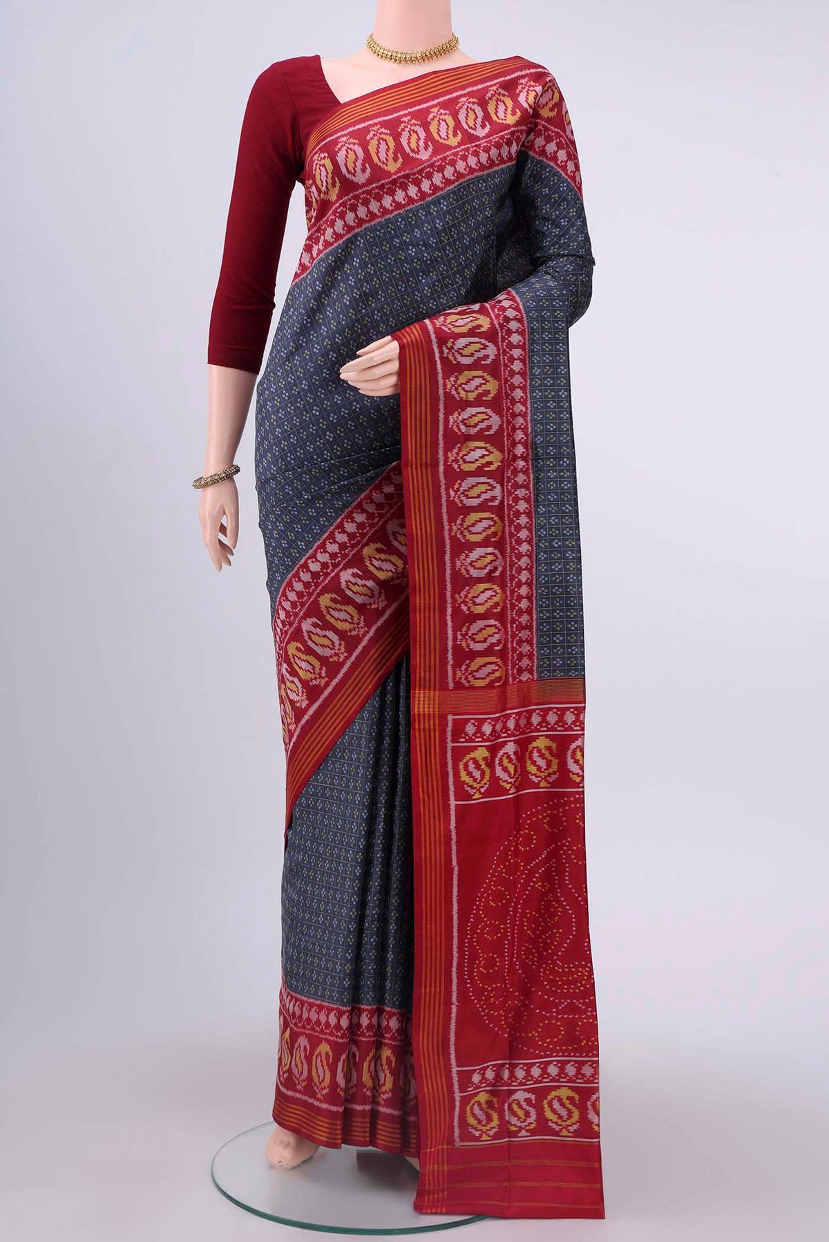 Blue Grey Dual Tone Rajkot Patola Silk Saree with Ikat design on the body and Zari Border displayed on a mannequin