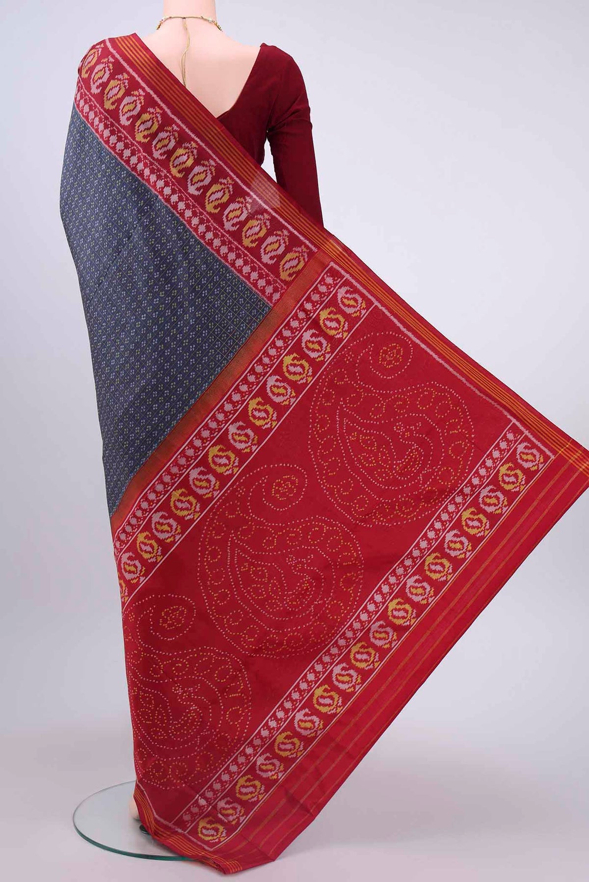 Flat view of Blue Grey Dual Tone Rajkot Patola Silk Saree with Ikat design on the body and Zari Border