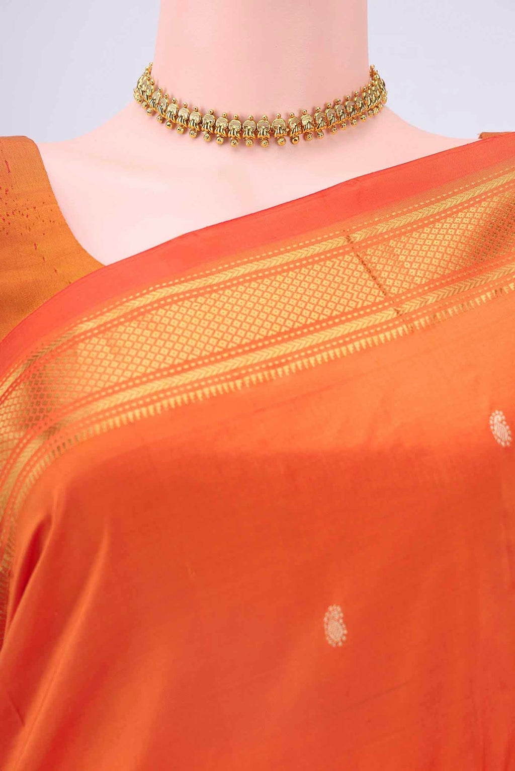 Border image of Brick Orange Paithani Silk Saree with Zari Butta on the body and Zari Border