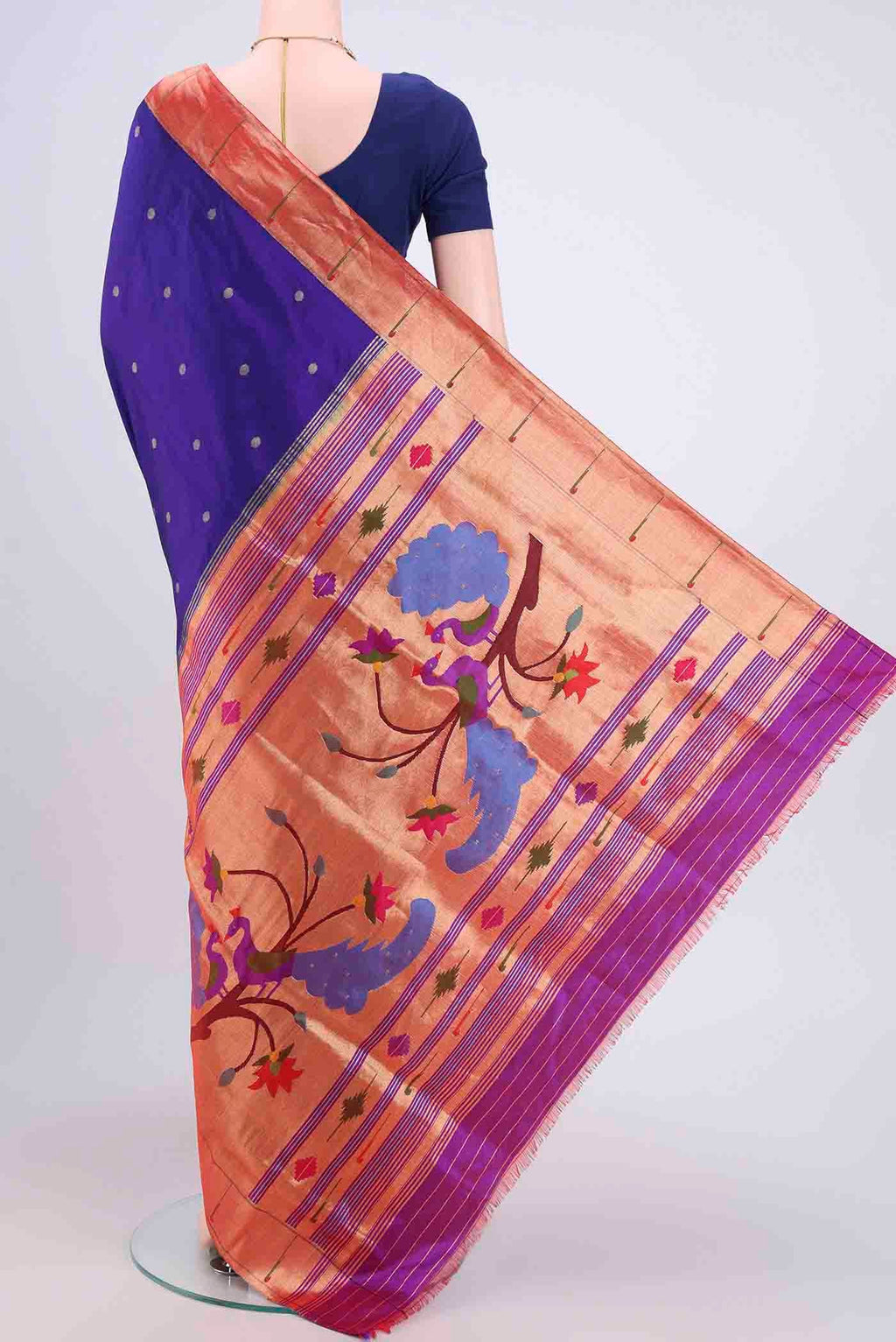 Flat view of Purple Paithani Silk Saree with Zari Butta on the body and Zari Border. 