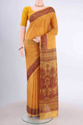 Mustard Printed Silk Saree with Floral Print on the body and Printed Border displayed on a mannequin