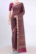 Magenta Printed Silk Saree with Floral Print on the body and Zari Border displayed on a mannequin
