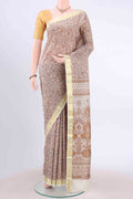 Off White Printed Silk Saree with Floral Print on the body and Zari Border displayed on a mannequin