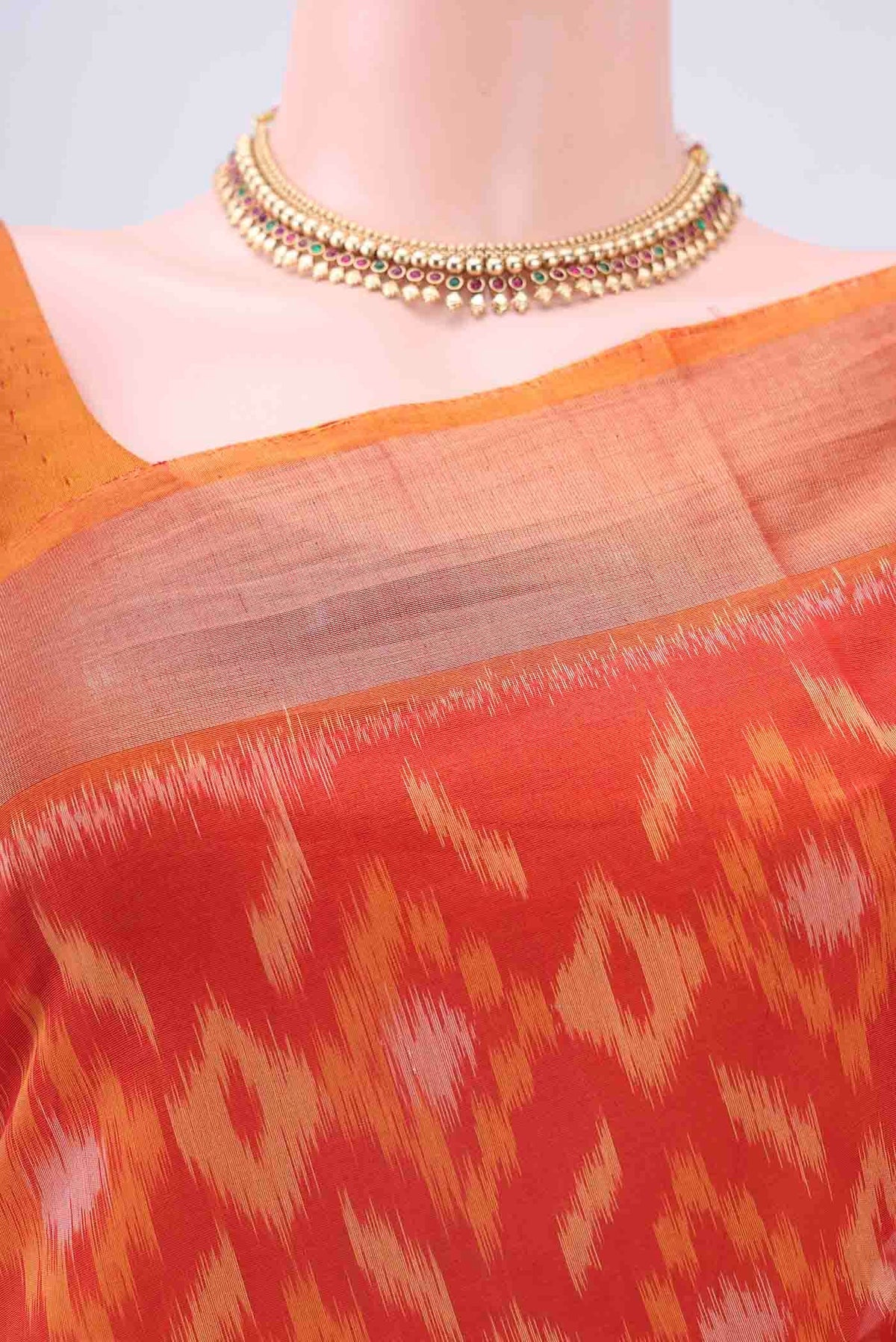 Border image of Orange Kora Cotton Saree with Ikat design on the body and Zari Border