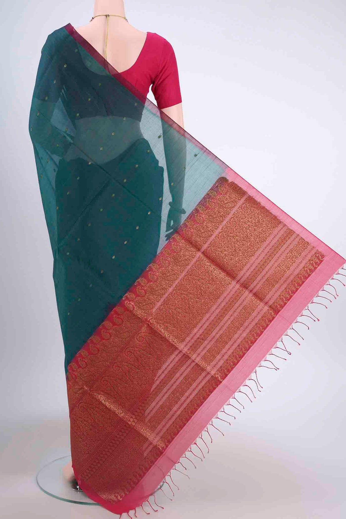 Flat view of Bottle Green Kora Cotton Saree with Zari Butta on the body and Zari Border
