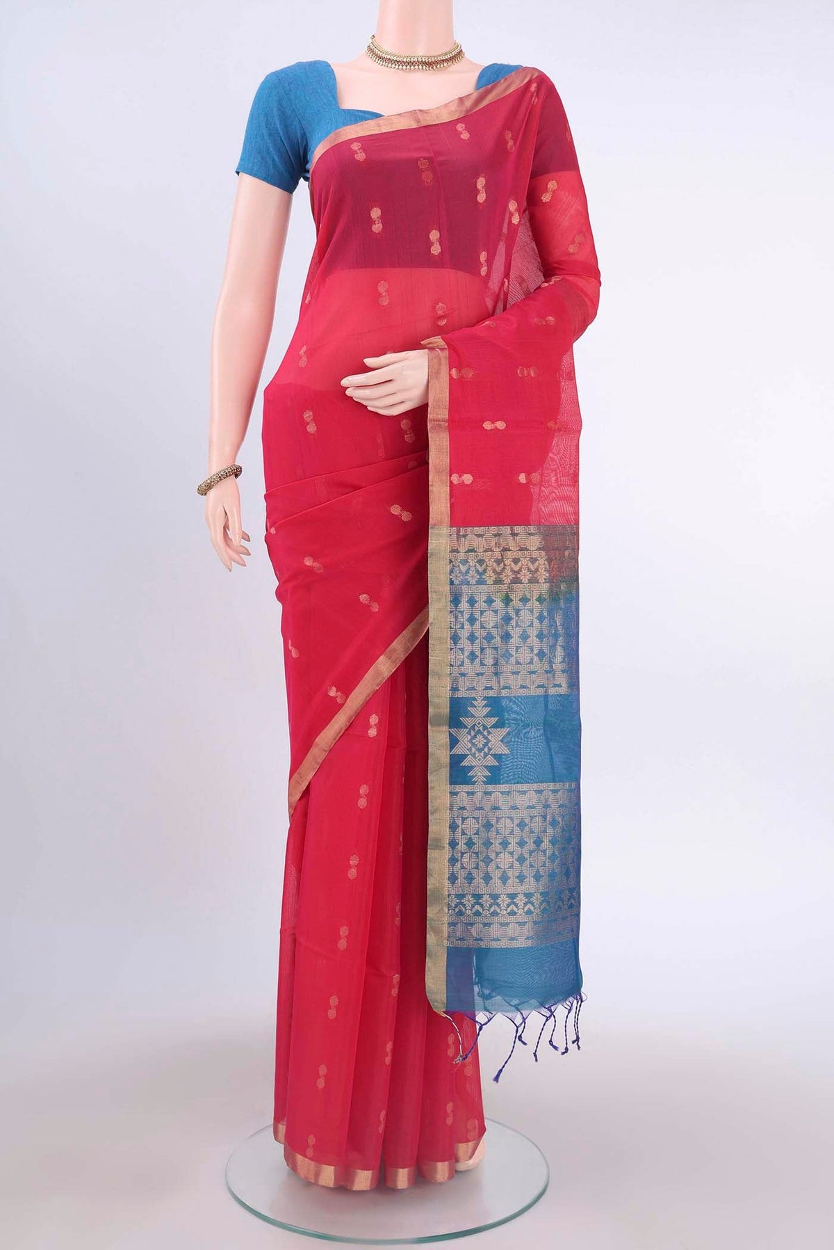 Imperial Red Kora Cotton Saree with Zari Butta on the body and Zari Border displayed on a mannequin