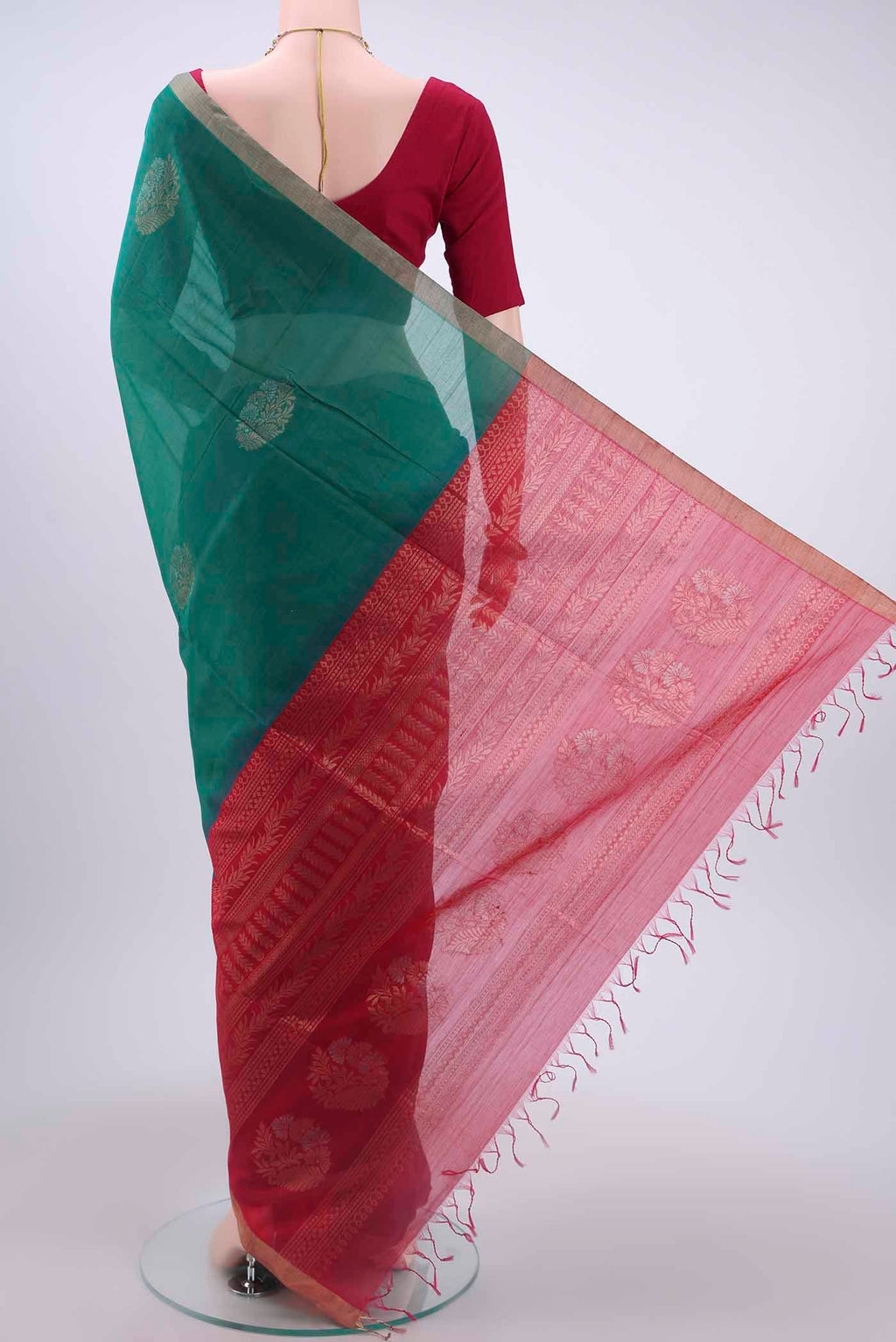 Flat view of Sea Green Kora Cotton Saree with Zari Butta on the body and Zari Border
