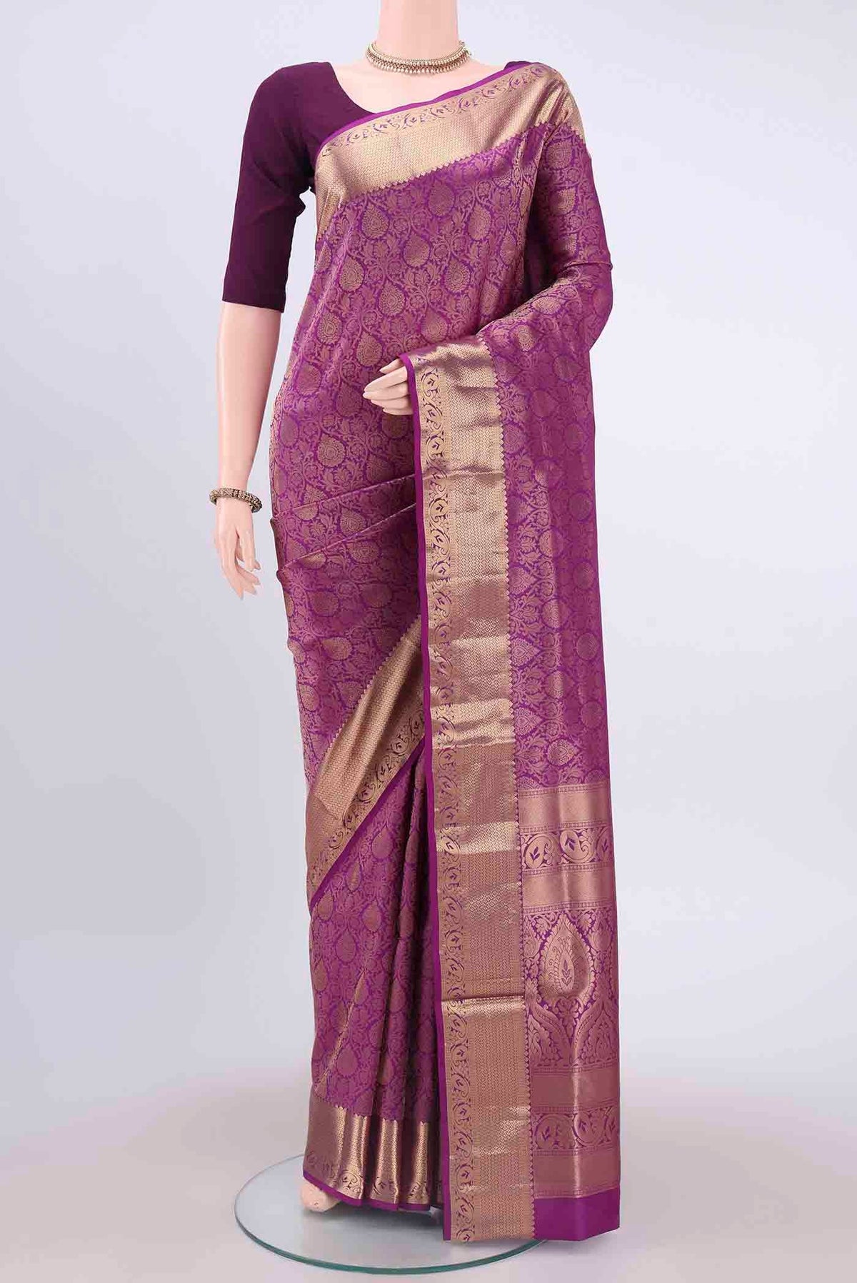 Purple Soft Silk Saree with Jacquard With Zari Butta on the body and Zari Border displayed on a mannequin