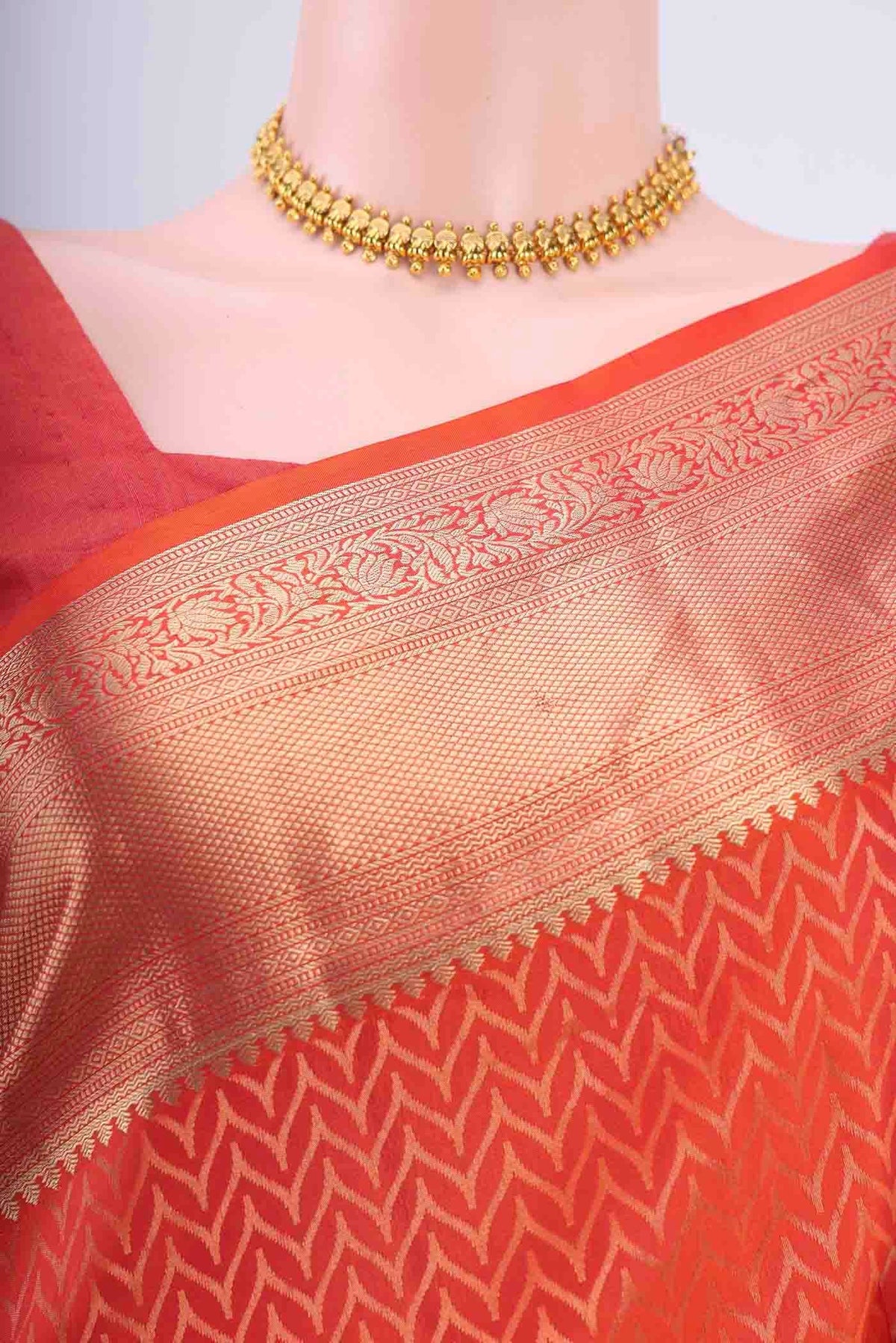 Border image of Brick Orange Soft Silk Saree with Jacquard With Zari Butta on the body and Zari Border