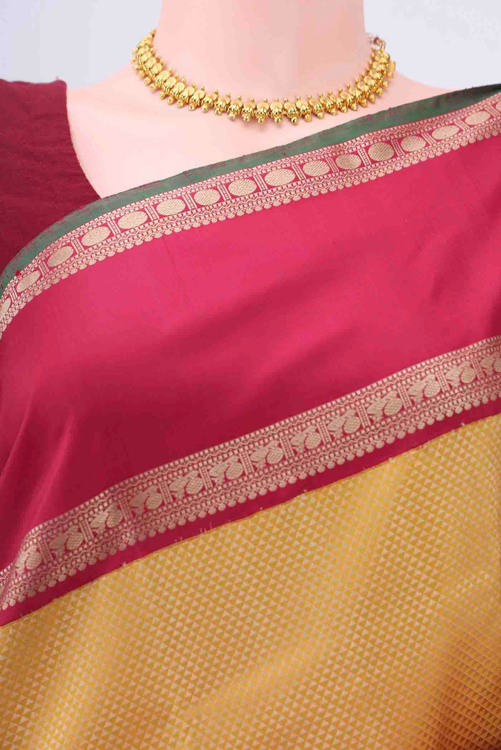 Border image of Yellow Kanchipuram Silk Saree with Jacquard design on the body and Thread Border