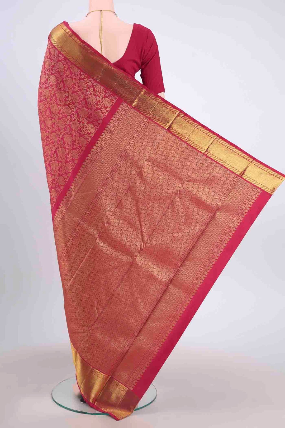 Flat view of Pure Silk Pure Zari Maroon Kanchipuram Saree with Zari Brocade on the body and Zari Border