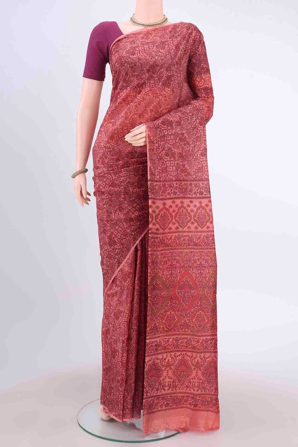 Peach Printed Silk Saree with Floral Print on the body and Without Border displayed on a mannequin