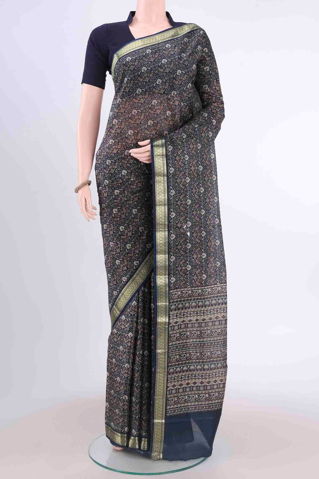 Blue Printed Silk Saree with Floral Print on the body and Zari Border displayed on a mannequin
