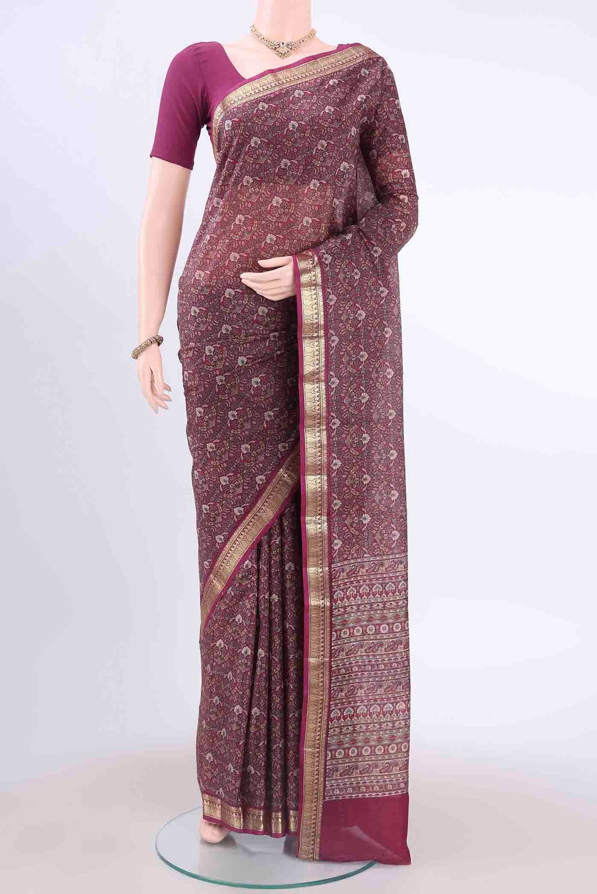 Magenta Printed Silk Saree with Floral Print on the body and Zari Border displayed on a mannequin