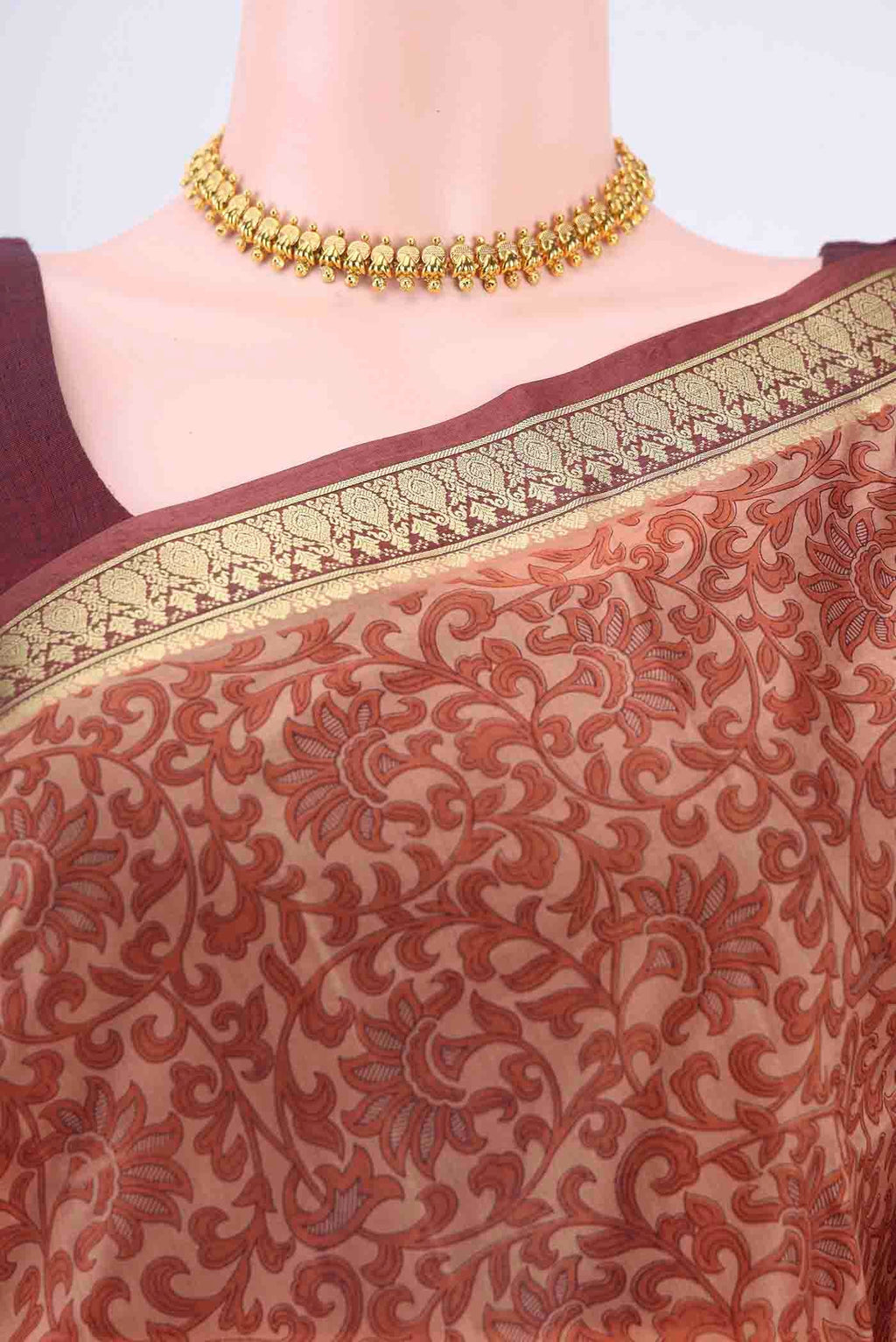 Border image of Rust Printed Silk Saree with Floral Print on the body and Zari Border