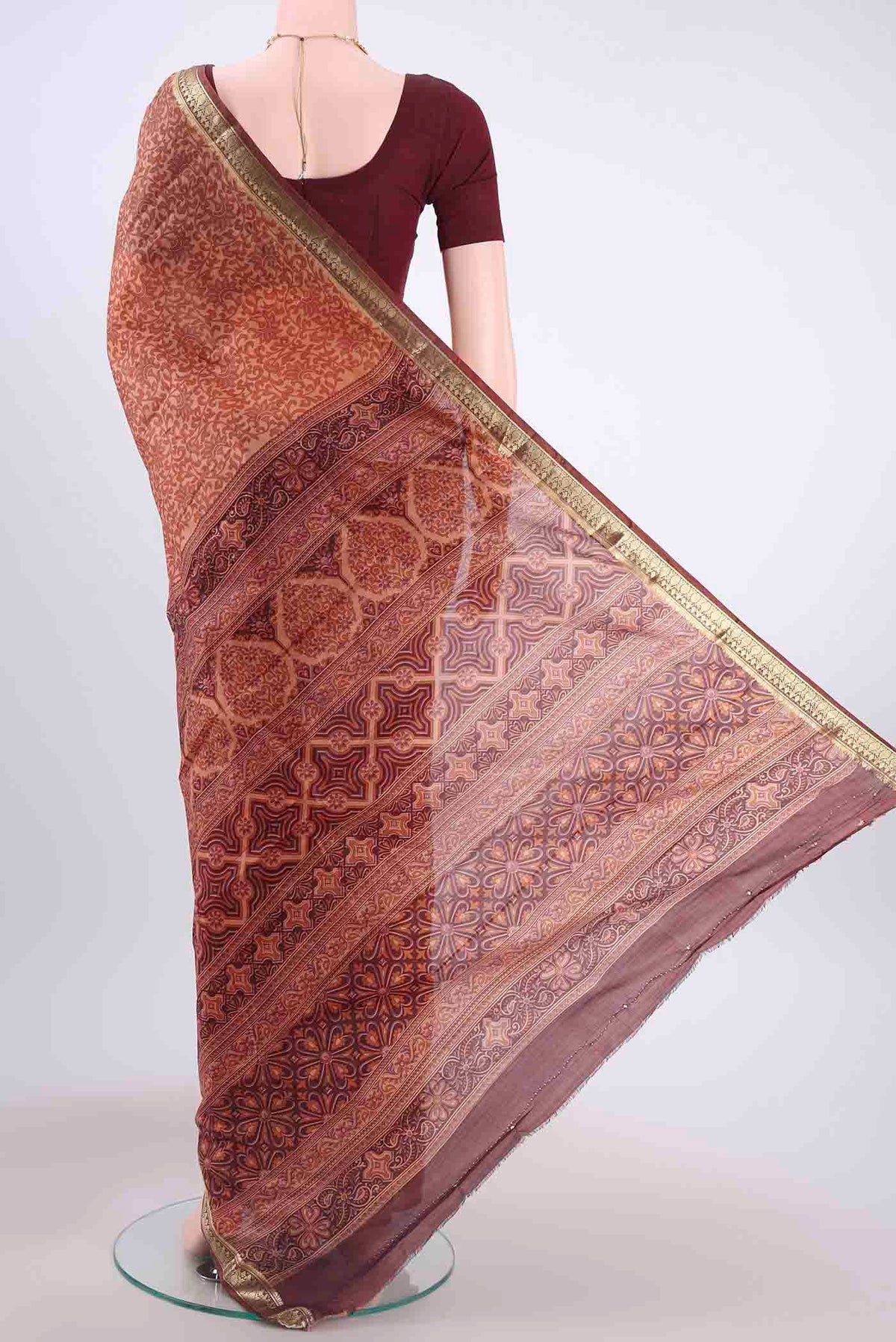 Flat view of Rust Printed Silk Saree with Floral Print on the body and Zari Border