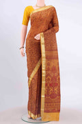 Mustard Printed Silk Saree with Floral Print on the body and Zari Border displayed on a mannequin