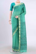 Light Green Printed Silk Saree with Floral Print on the body and Zari Border displayed on a mannequin