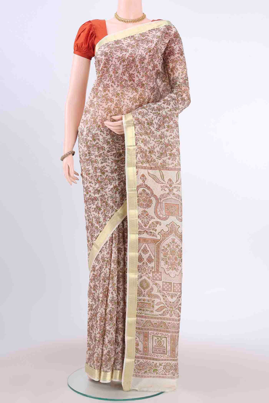 Off White Printed Silk Saree with Floral Print on the body and Zari Border displayed on a mannequin