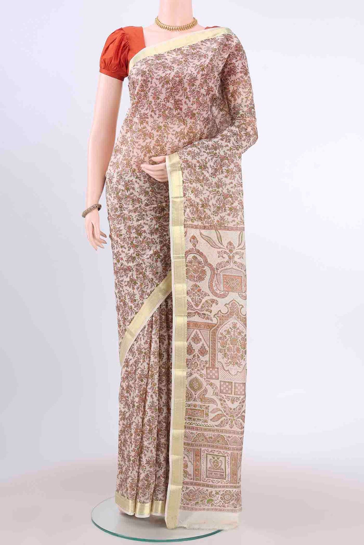 Off White Printed Silk Saree with Floral Print on the body and Zari Border displayed on a mannequin