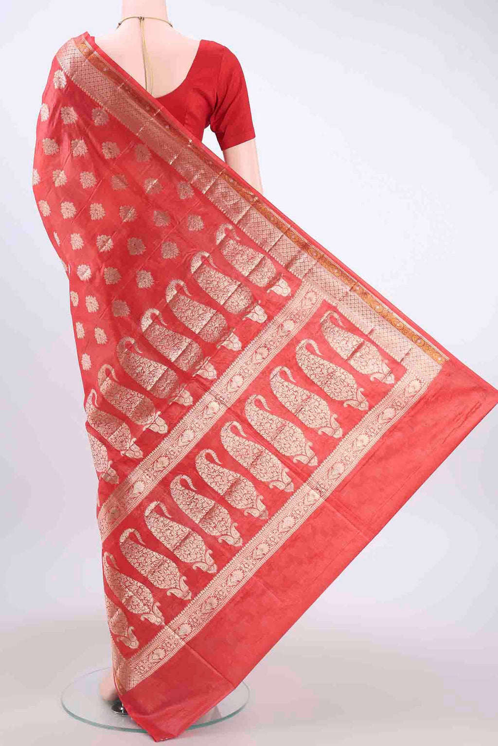 Flat view of Red Banarasi Tussar Silk Saree with Zari Butta on the body and Zari Border