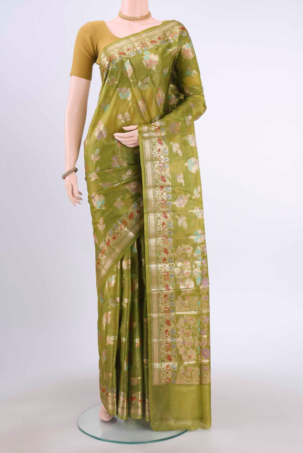 Green Banarasi Tussar Silk Saree with Zari And Thread Butta on the body and Zari And Thread Border displayed on a mannequin