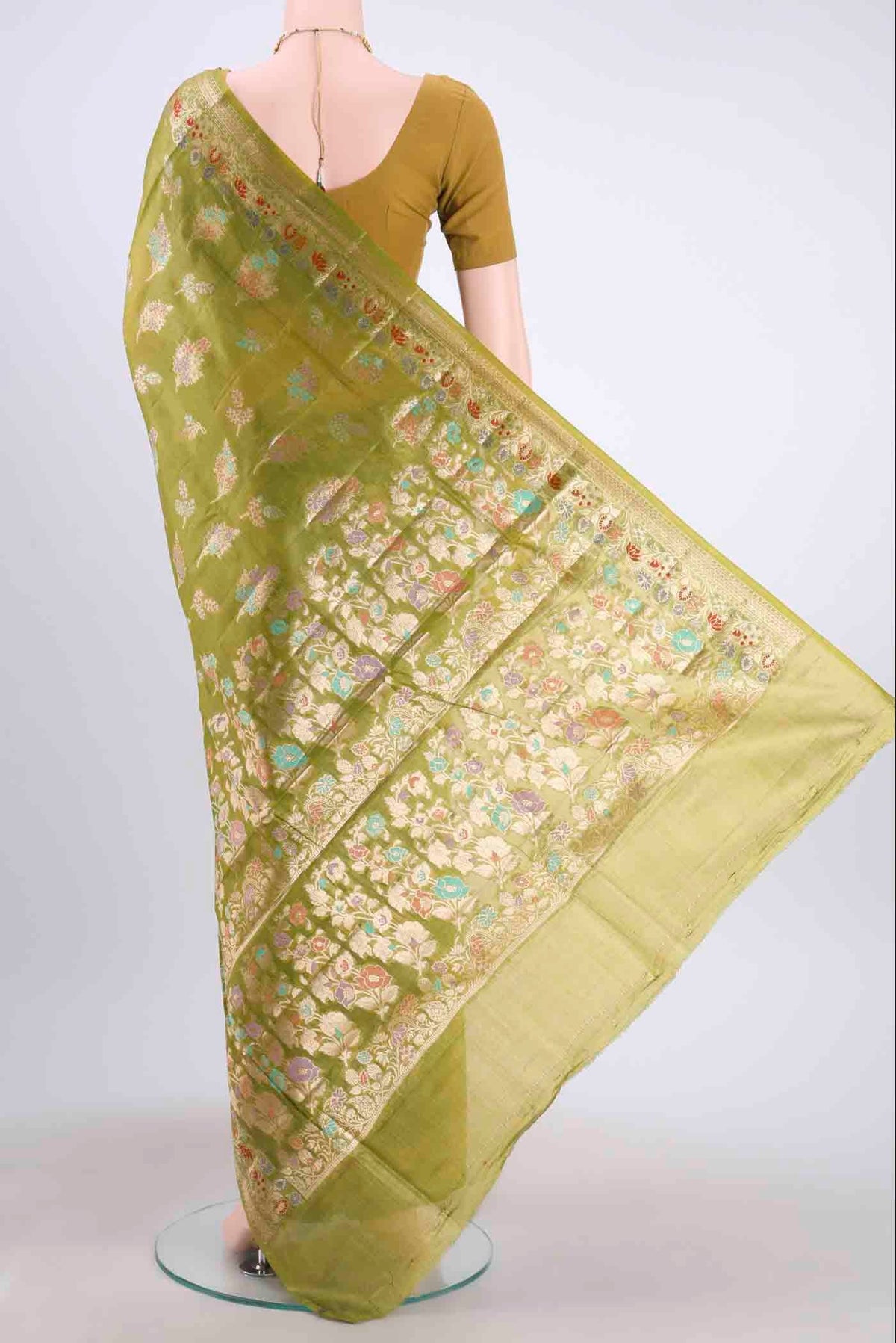 Flat view of Green Banarasi Tussar Silk Saree with Zari And Thread Butta on the body and Zari And Thread Border