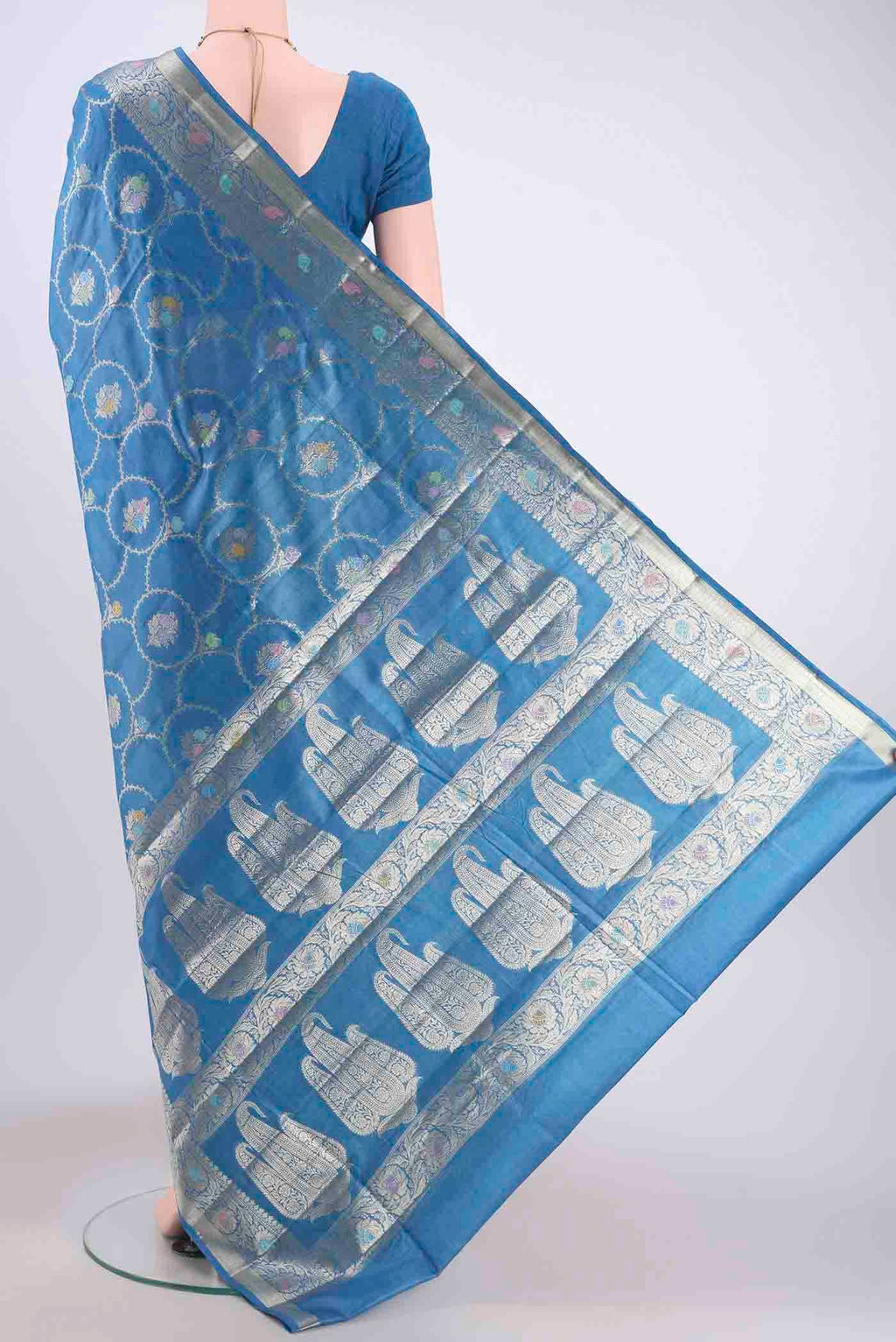 Flat view of Blue Banarasi Tussar Silk Saree with Zari And Thread Butta on the body and Zari Border