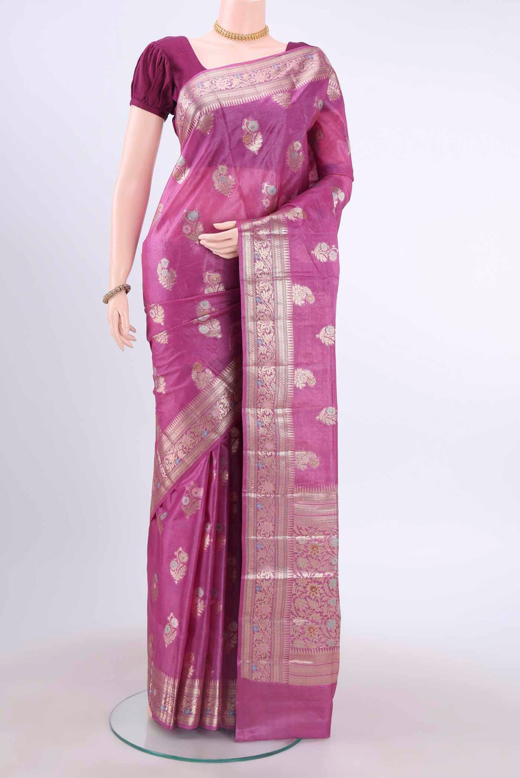 Magenta Banarasi Tussar Silk Saree with Zari And Thread Butta on the body and Zari Border displayed on a mannequin