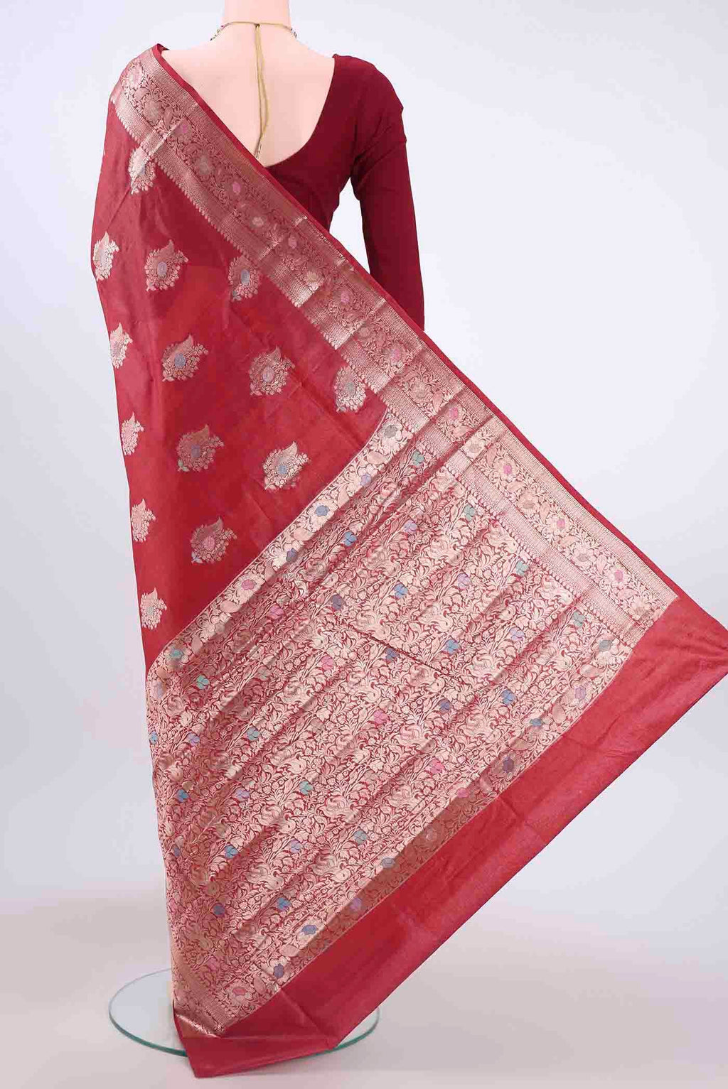Flat view of Maroon Banarasi Tussar Silk Saree with Zari And Thread Butta on the body and Zari And Thread Border