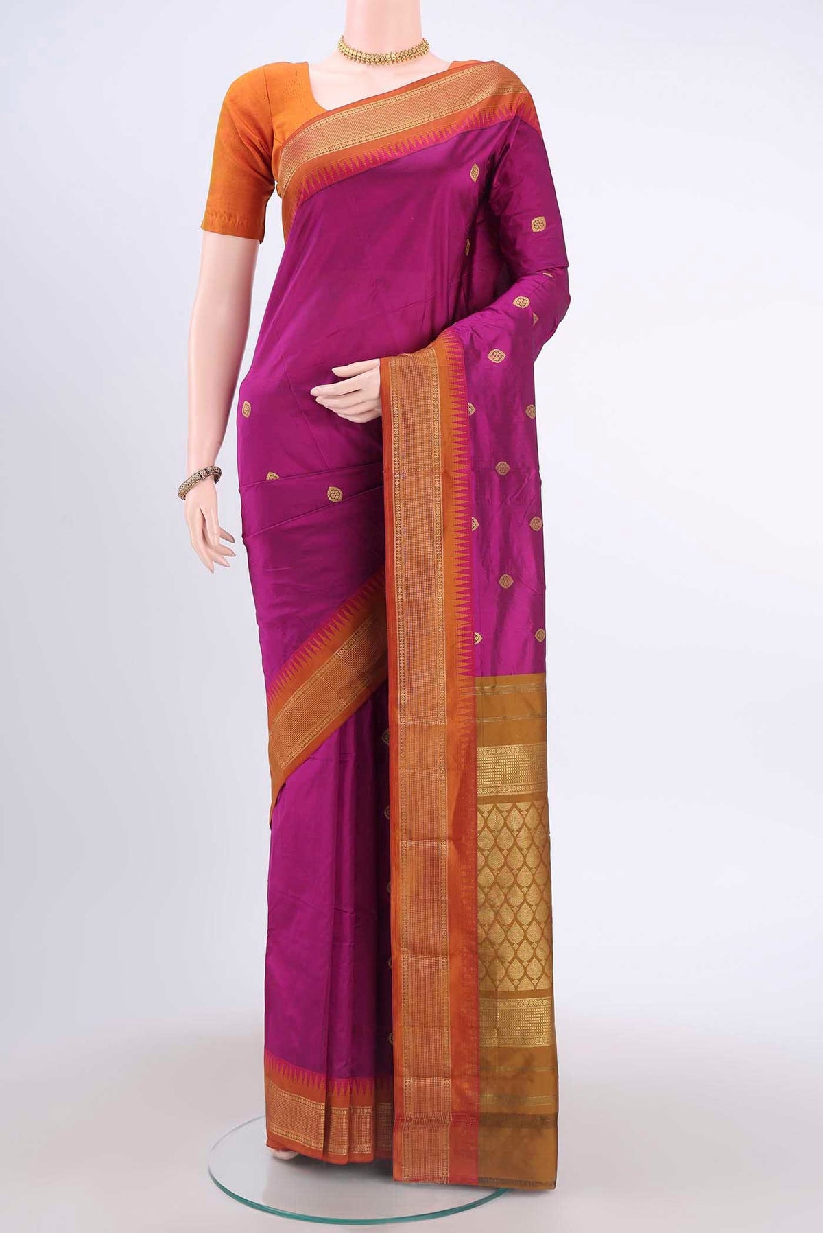 Magenta Blended Bangalore Silk Saree with Zari Butta on the body and Zari Border displayed on a mannequin
