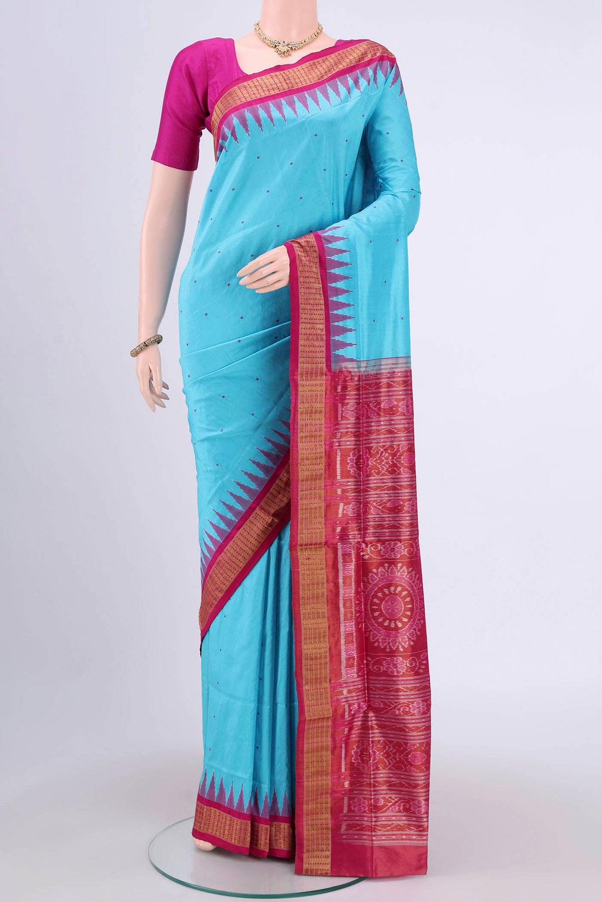 Turquoise Orissa Silk Saree with Thread Butta on the body and Zari Border.  displayed on a mannequin