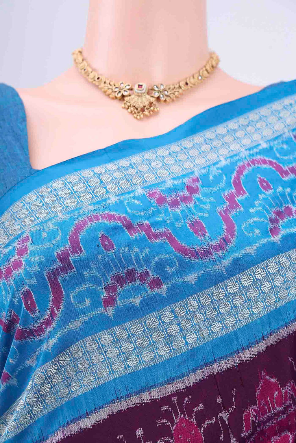 Border image of Purple Orissa Silk Saree with Ikat design on the body and Thread Border. 