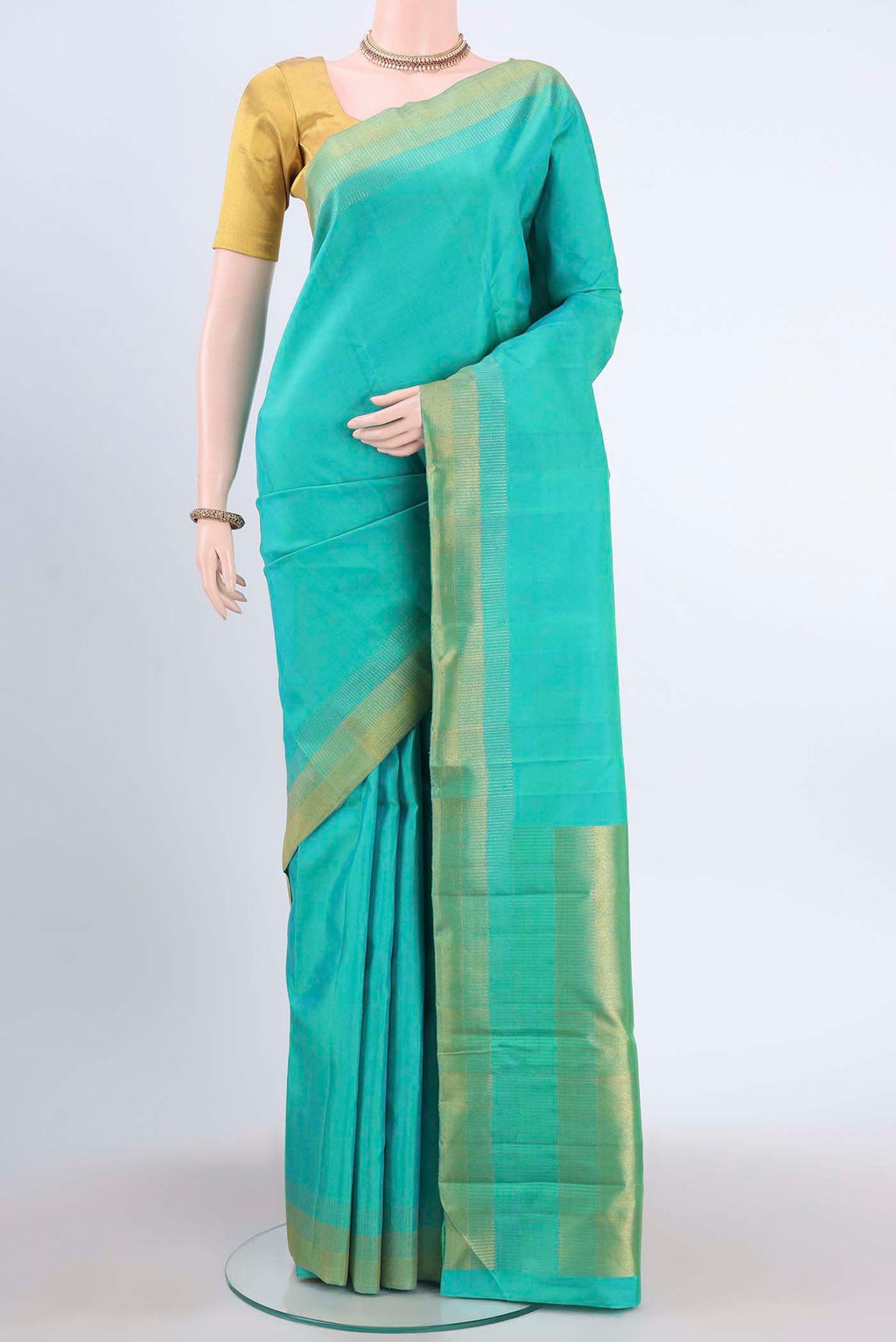 Pure Silk Pure Zari Sea Green Dual Tone Kanchipuram Saree with Plain Body and Zari Border displayed on a mannequin