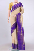 Pure Silk Pure Zari Off White Kanchipuram Saree with Zari Butta on the body and Zari Border displayed on a mannequin
