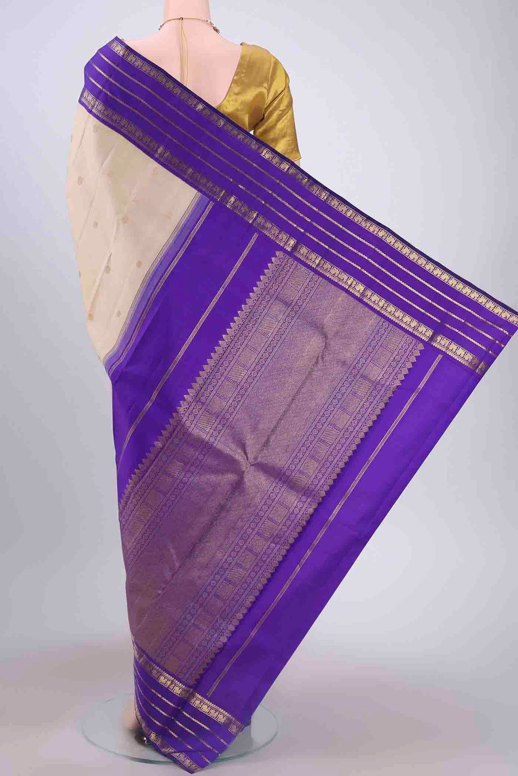 Flat view of Pure Silk Pure Zari Off White Kanchipuram Saree with Zari Butta on the body and Zari Border