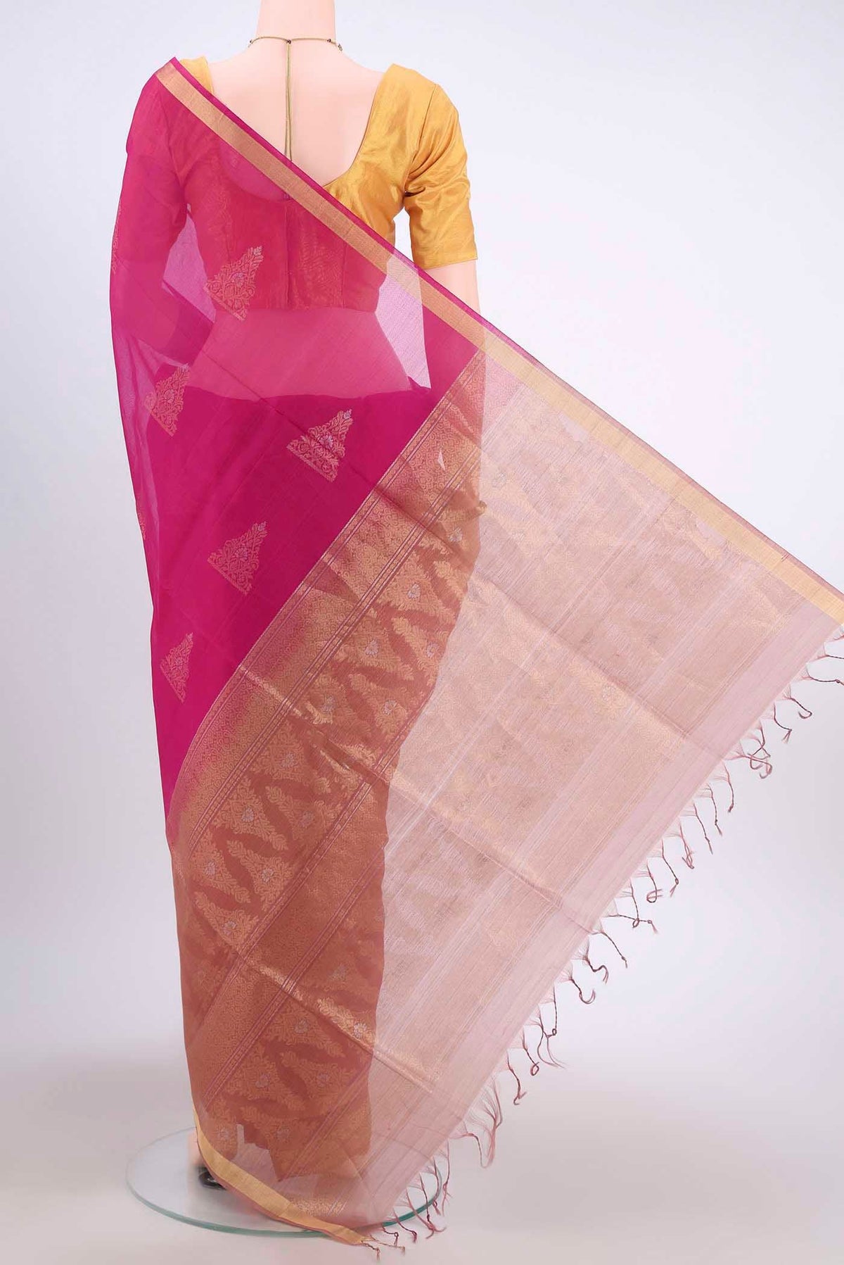 Flat view of Dark Pink Kora Cotton Saree with Zari Butta on the body and Zari Border