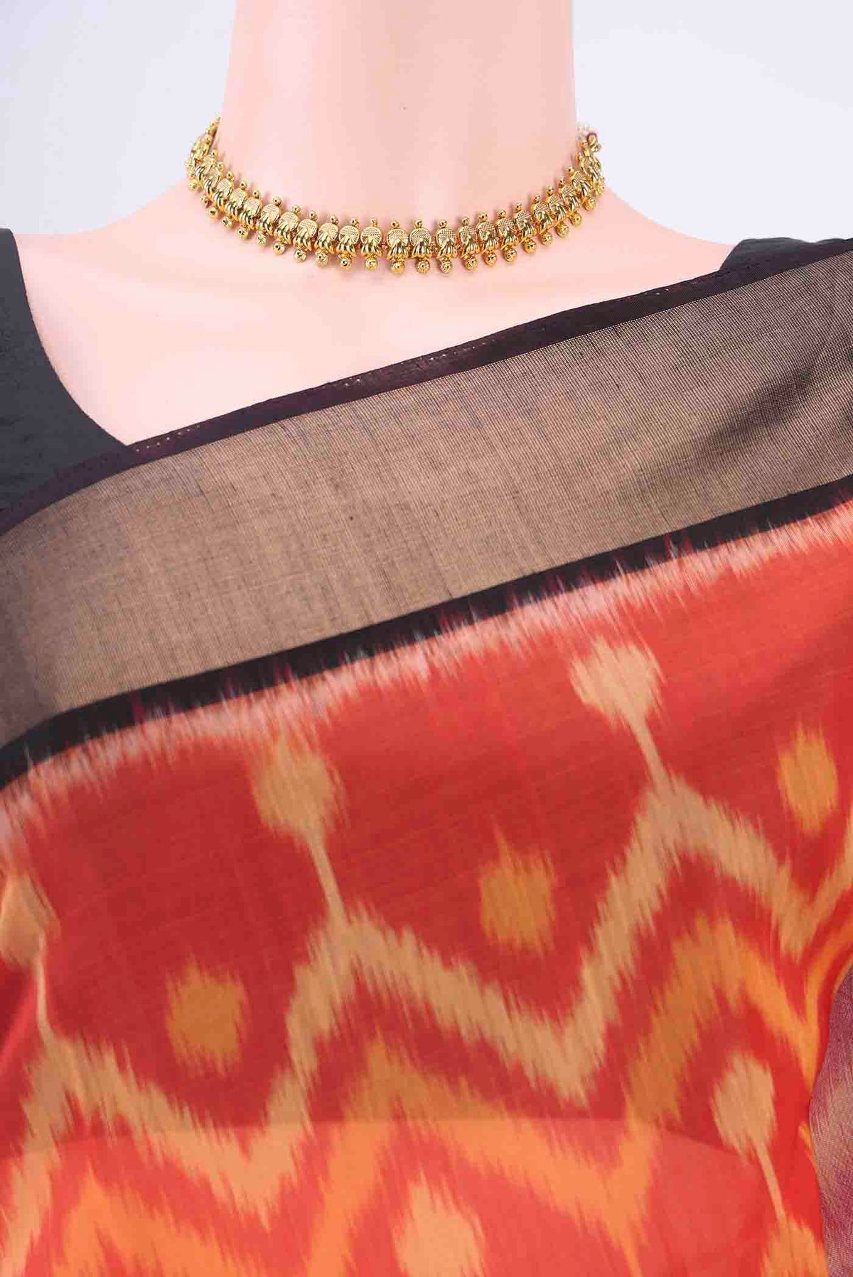 Border image of Brick Orange Kora Cotton Saree with Ikat Print on the body and Zari Border
