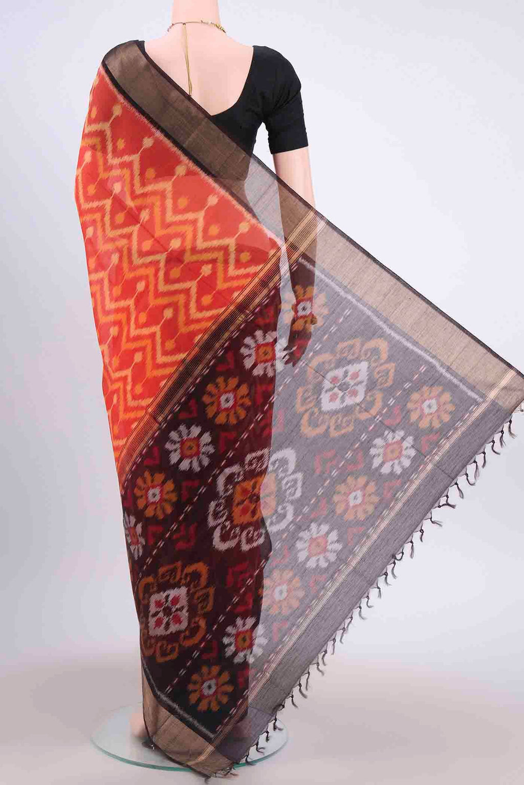 Flat view of Brick Orange Kora Cotton Saree with Ikat Print on the body and Zari Border