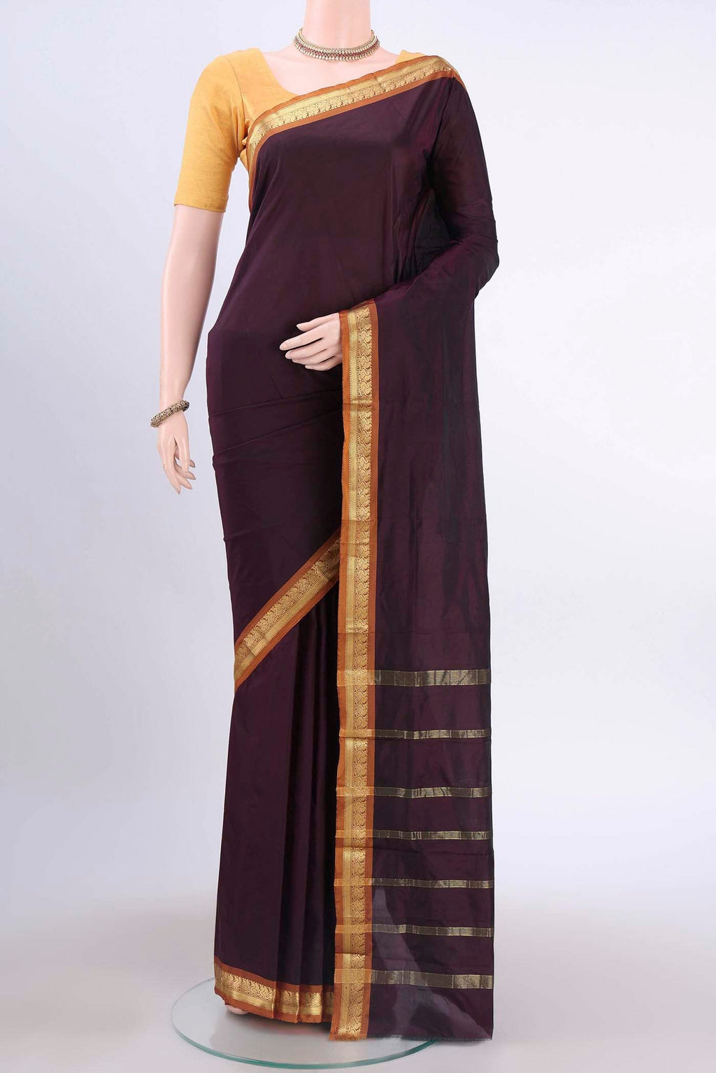 Brown Blended Bangalore Silk Saree with Plain Body and Zari Border displayed on a mannequin