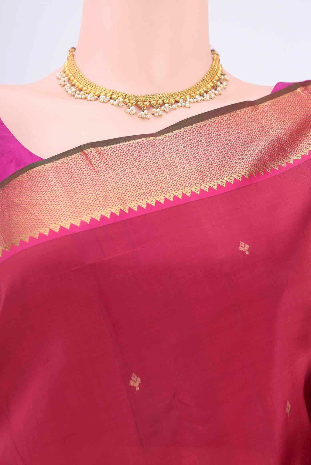 Border image of Maroon Kanchipuram Silk Saree with Zari Butta on the body and Zari Border