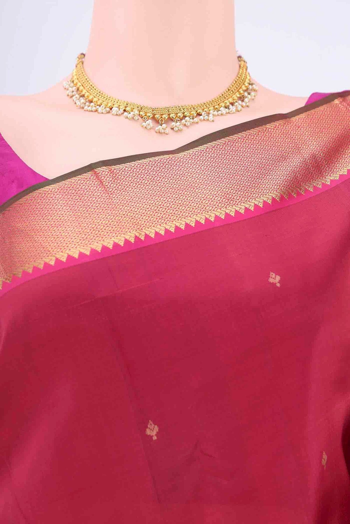 Border image of Maroon Kanchipuram Silk Saree with Zari Butta on the body and Zari Border