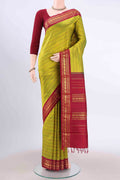 Light Green Kanchipuram Silk Saree with Stripes on the body and Zari Border displayed on a mannequin