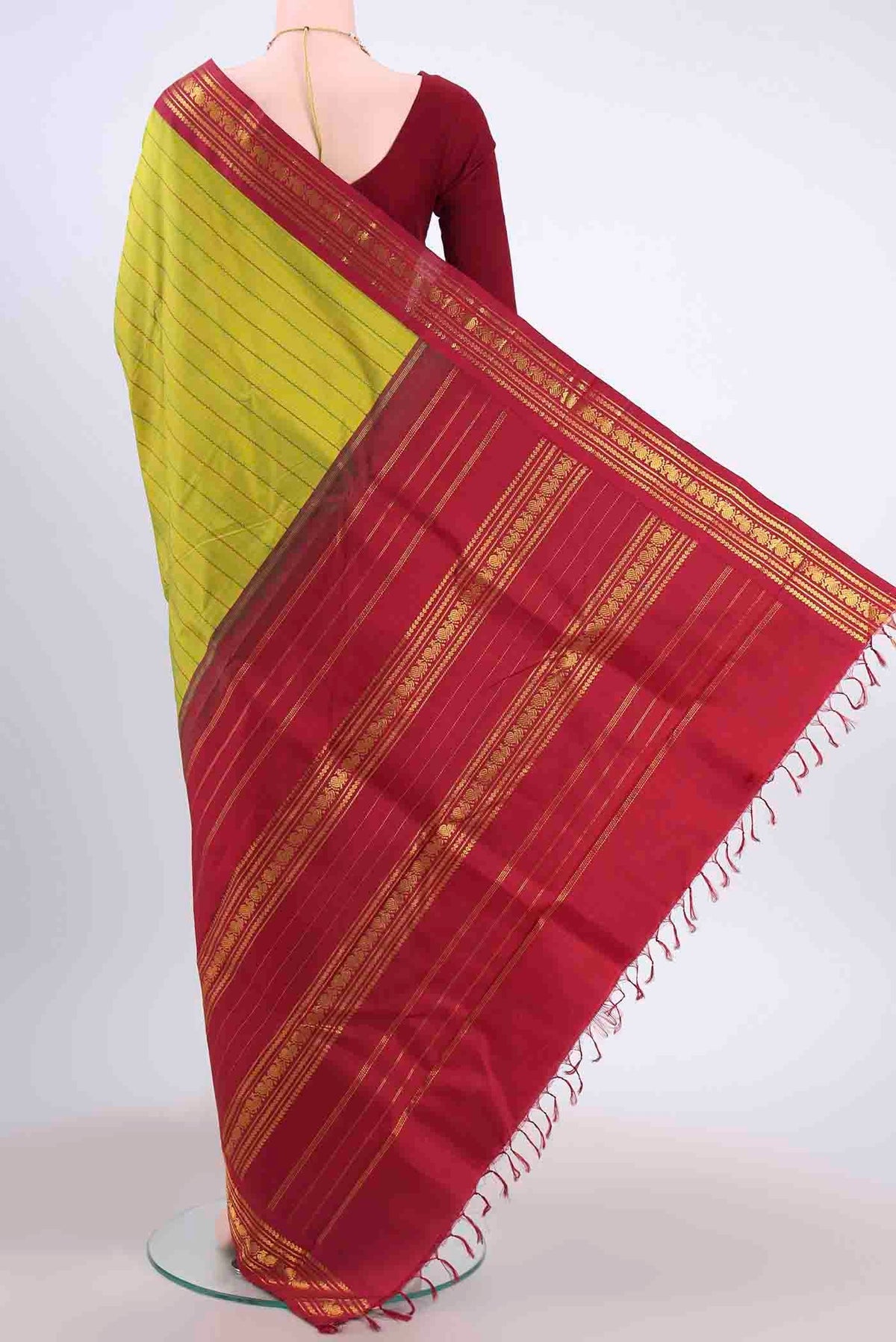 Flat view of Light Green Kanchipuram Silk Saree with Stripes on the body and Zari Border