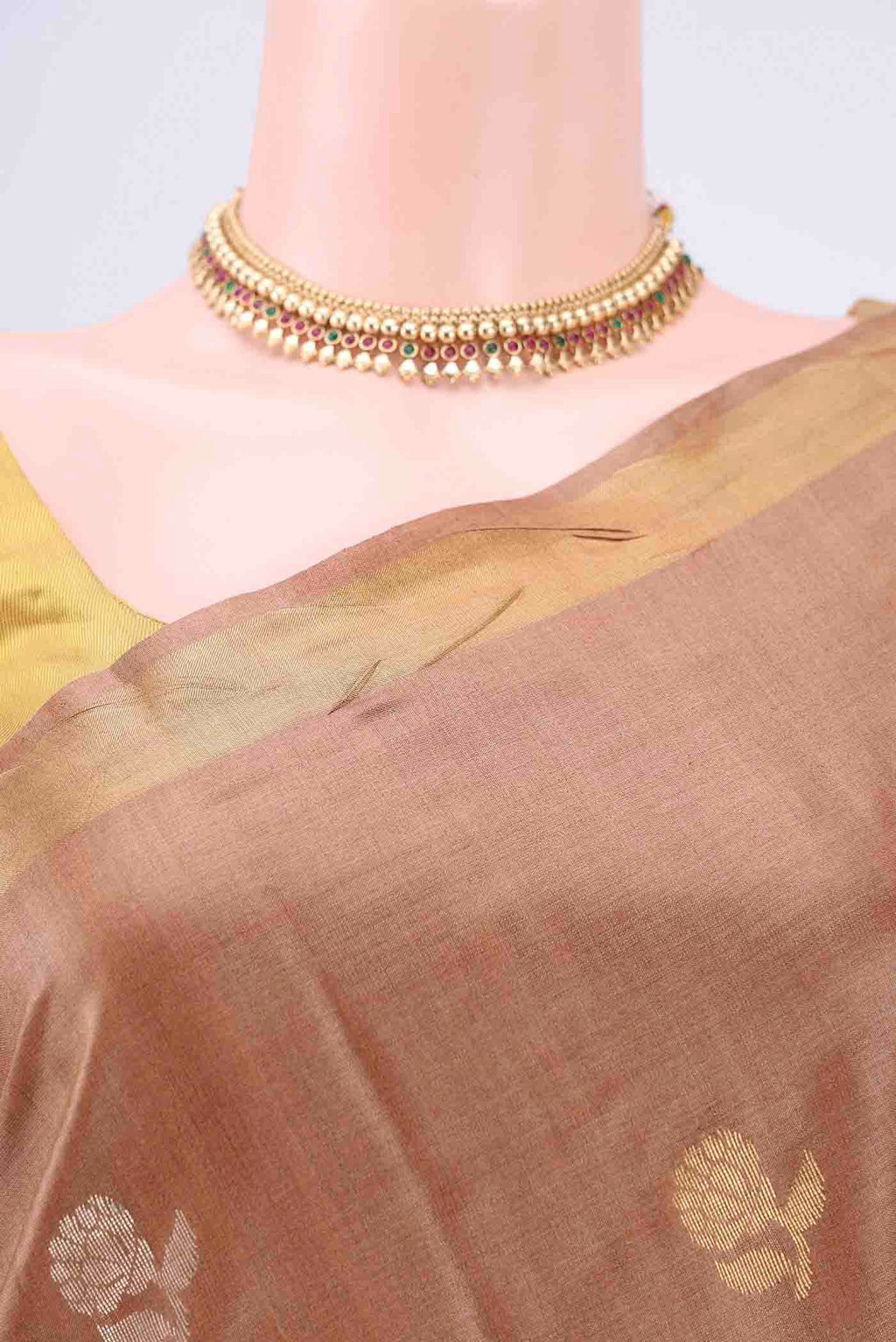 Border image of Brown Tussar Silk Saree with Zari Butta on the body and Zari Border. 