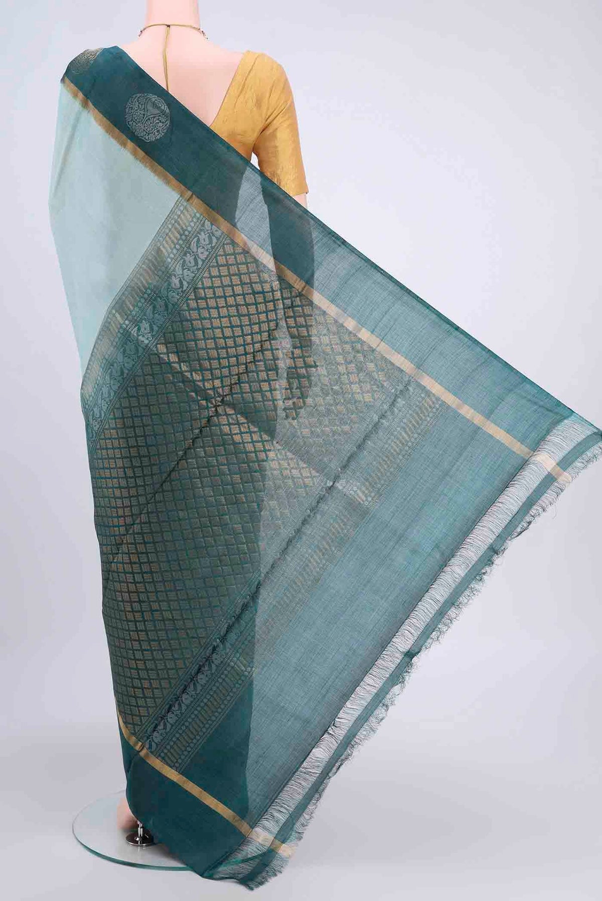 Flat view of Light Blue Tussar Silk Saree with Plain Body and Zari Border