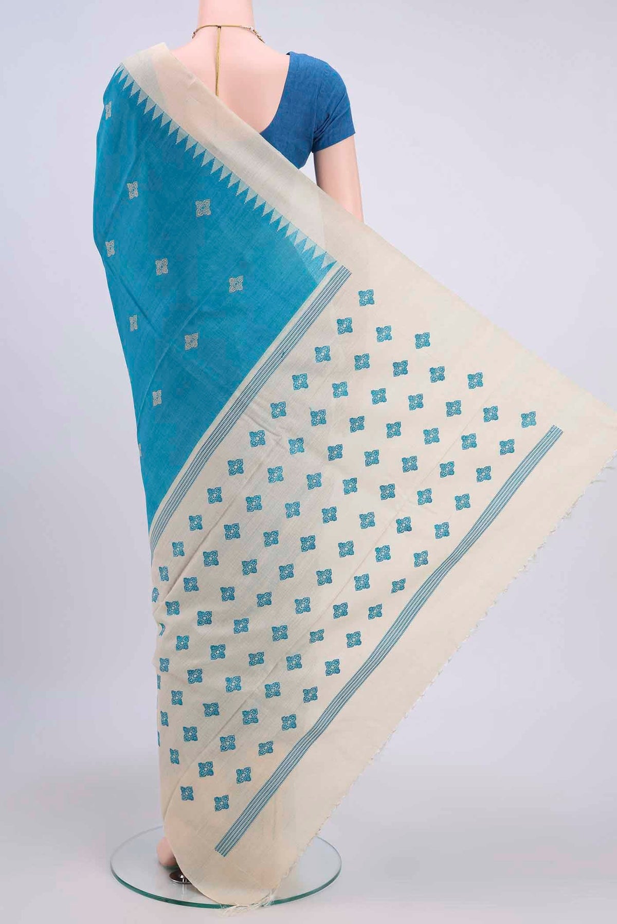 Flat view of Blue Tussar Silk Saree with Thread Butta on the body and Zari Border