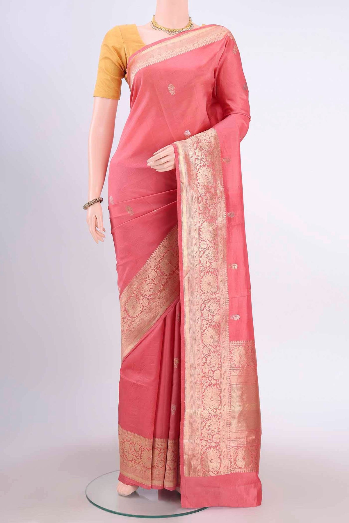 Peach Banarasi Katan Silk Saree with Zari Butta on the body and Silk Border displayed on a mannequin