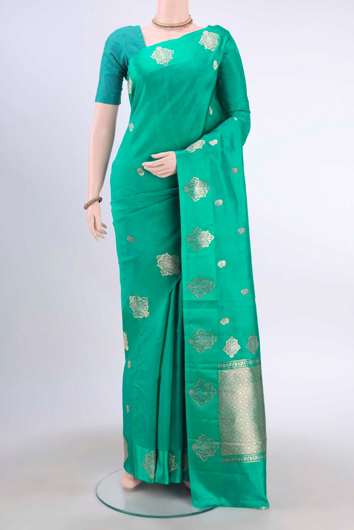 Sea Green Banarasi Katan Silk Saree with Zari Butta on the body and Satin Border displayed on a mannequin