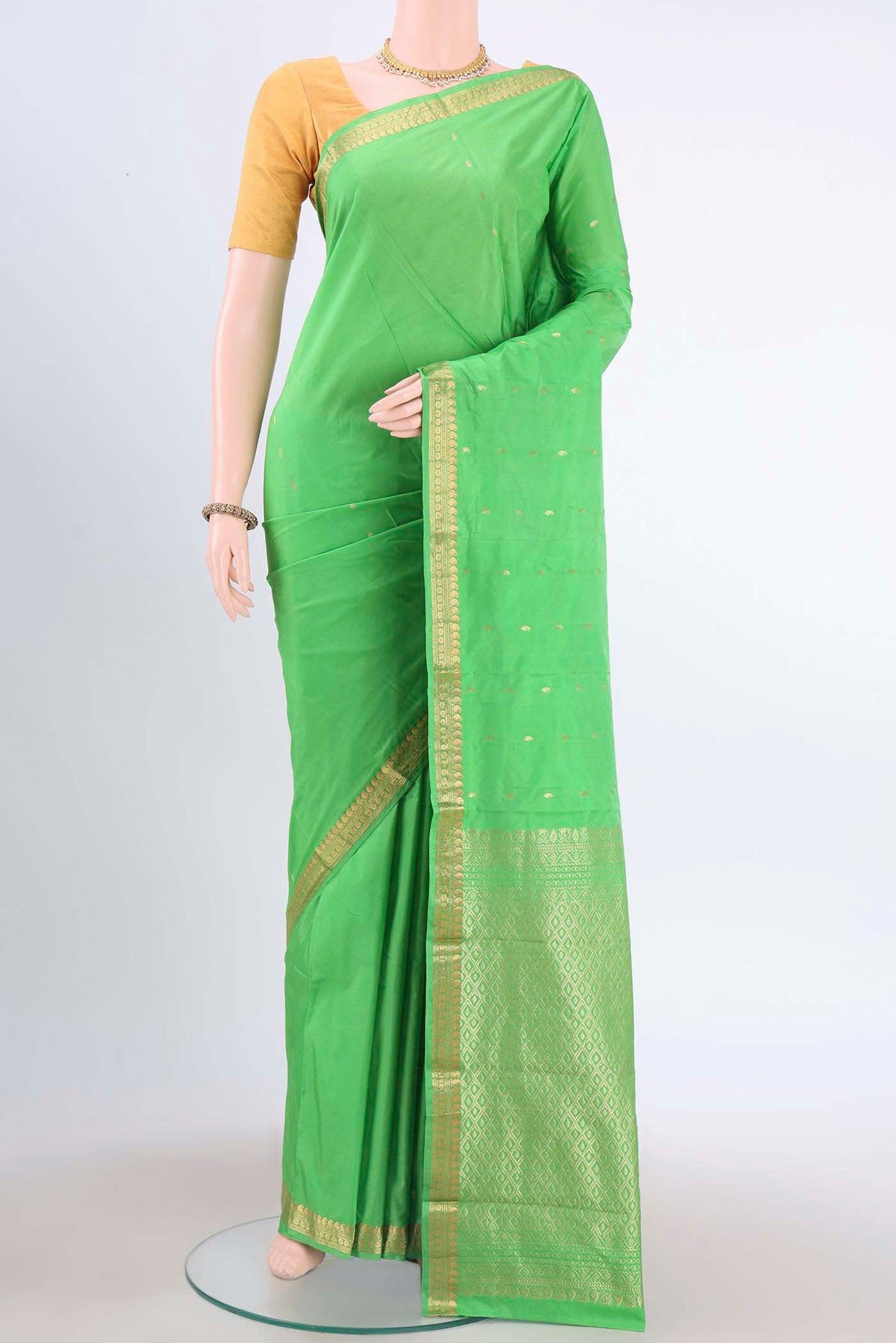 Parrot Green Blended Bangalore Silk Saree with Zari Butta on the body and Zari Border displayed on a mannequin